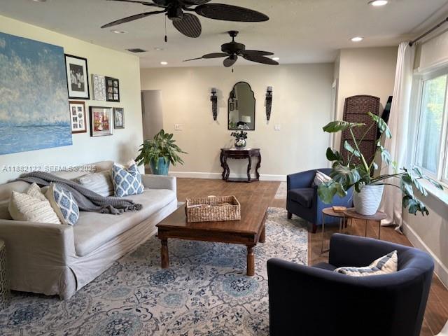 19420 Southwest 307th Street Homestead, FL 33030 - Photo 5 of 17 a living room with furniture and a potted plant