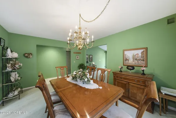 a kitchen with stainless steel appliances granite countertop a refrigerator a sink and cabinets