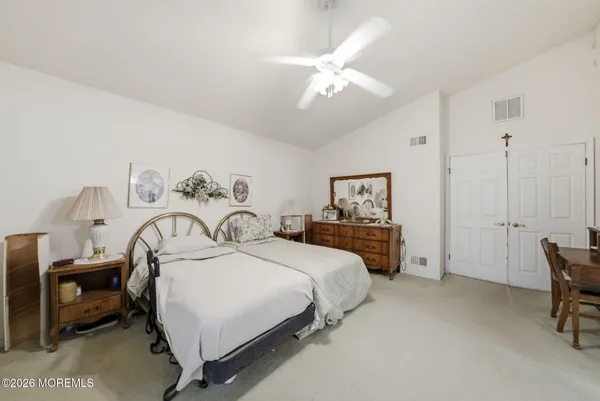 a bed room with furniture and a window