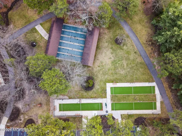 an aerial view of a house with a yard