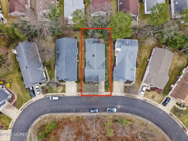 an aerial view of a house with yard swimming pool and outdoor seating