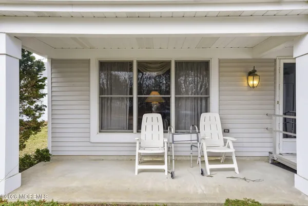 a house that has a tree in front of it