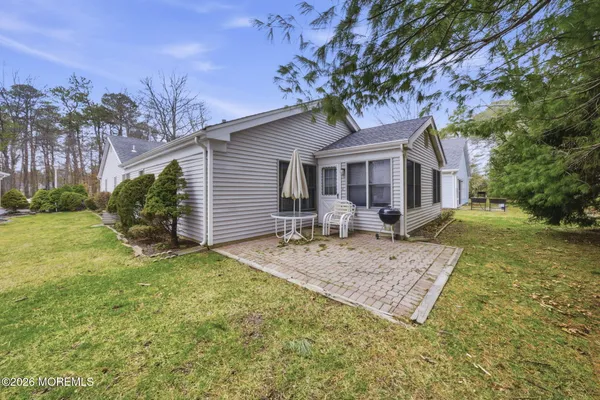 a living room with furniture and large windows
