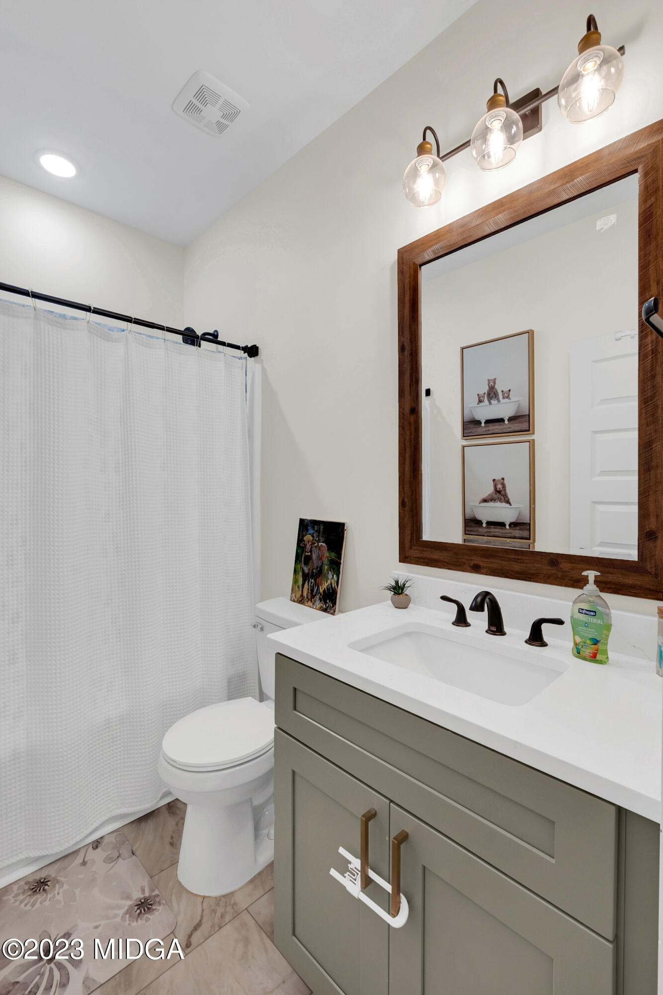 7370 Thomaston Road Macon, GA 31220 - Photo 59 of 81 a bathroom with a toilet sink and mirror