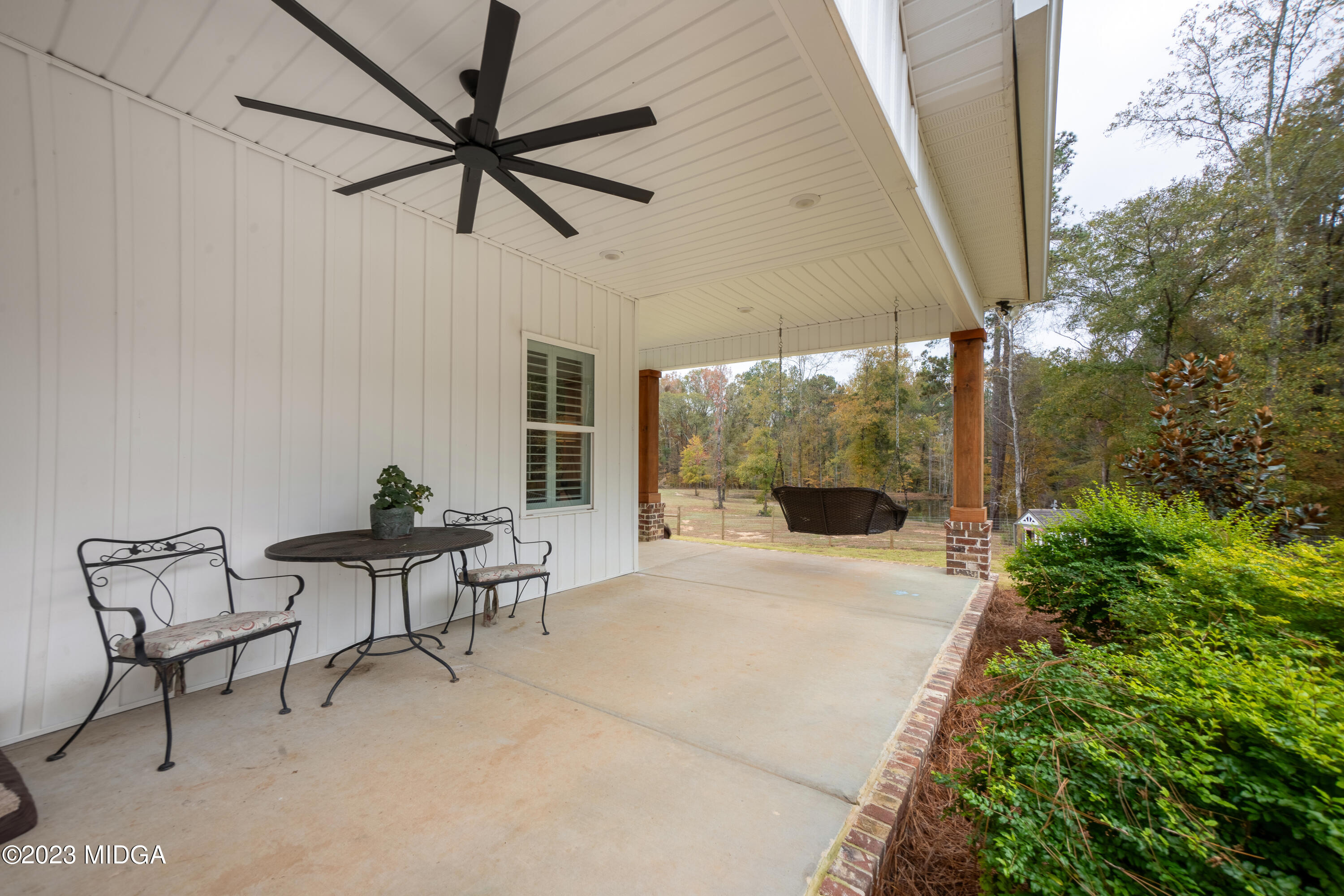 7370 Thomaston Road Macon, GA 31220 - Photo 8 of 81 a view of a patio with a table and chairs under an umbrella