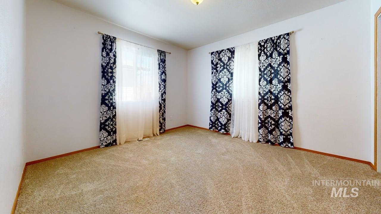 2794 9th Avenue Clarkston, WA 99403 - Photo 20 of 34 Empty room featuring light colored carpet and baseboards