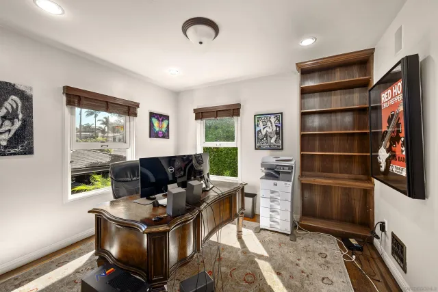 a living room with furniture a window and bookshelf