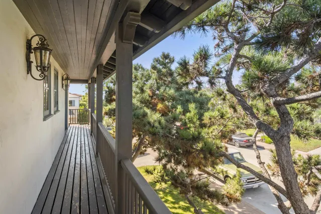 a view of balcony with wooden floor