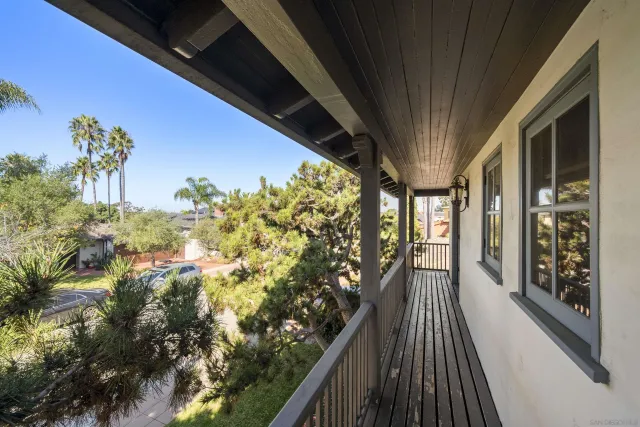 a view of balcony with wooden floor