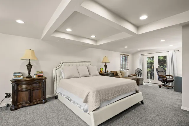 a living room with furniture a lamp and a window