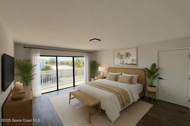 a bedroom with a large bed and a tv