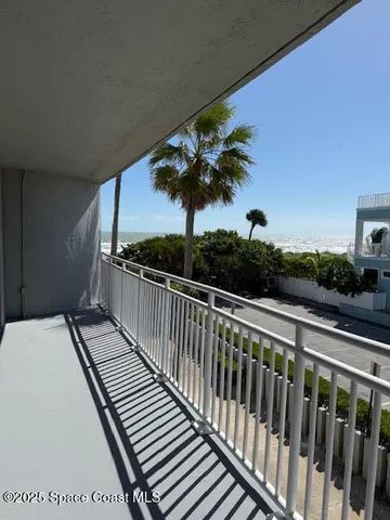 a view of balcony with wooden floor