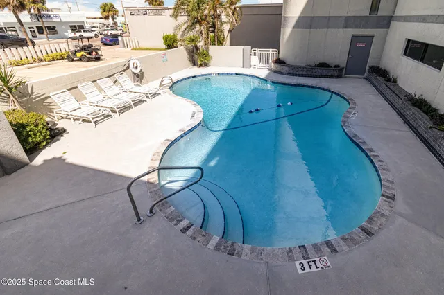 an aerial view of a swimming pool