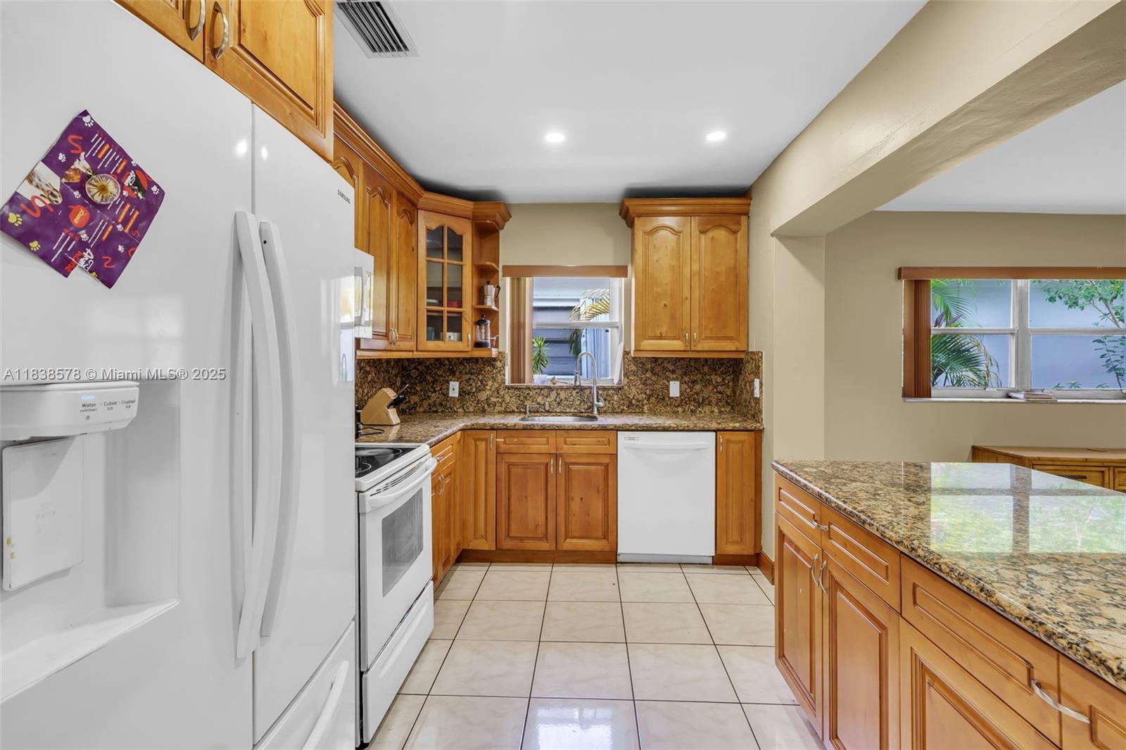 2761 Southwest 33rd Court Miami, FL 33133 - Photo 12 of 46 a kitchen with a refrigerator sink and stove