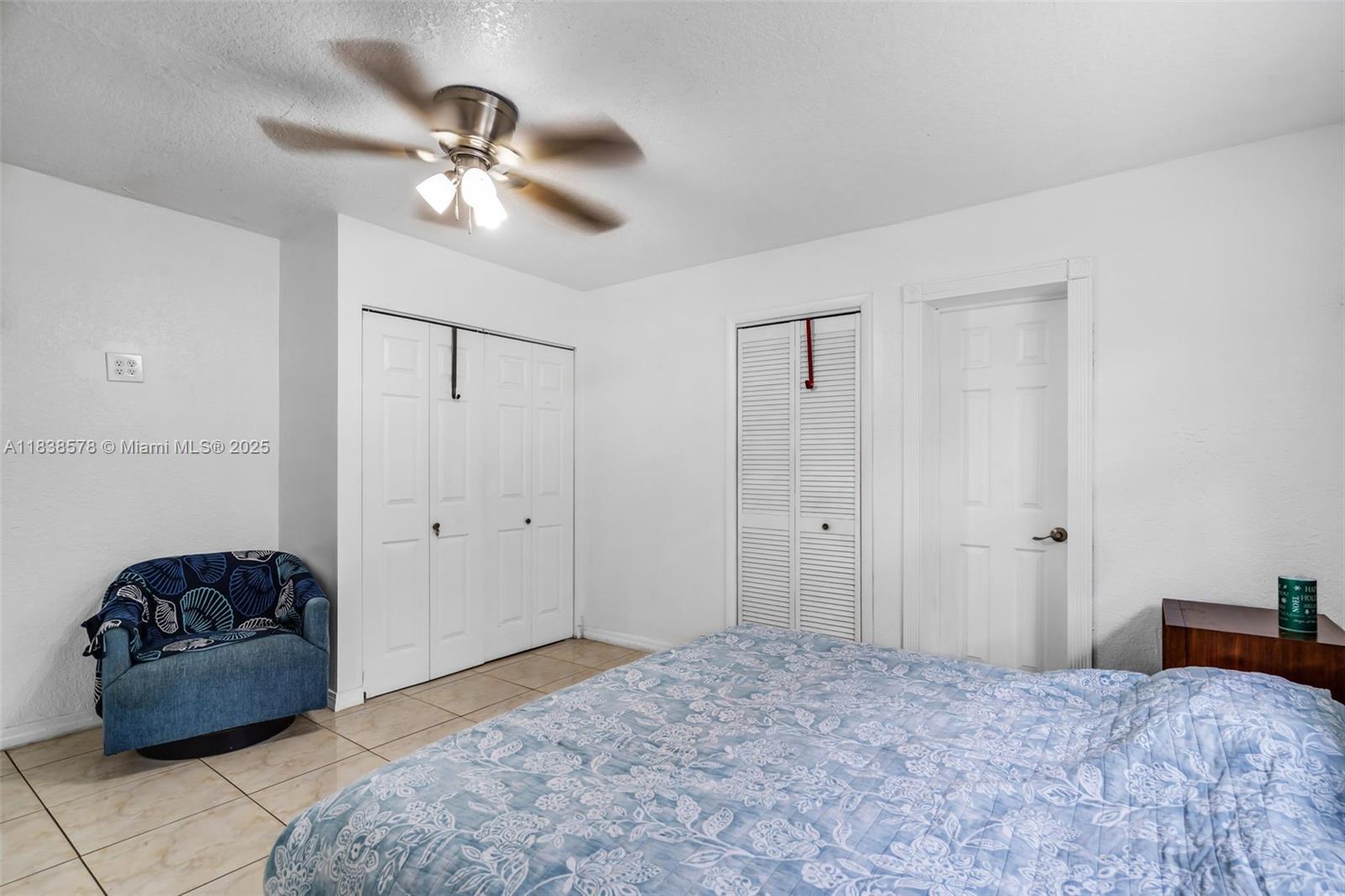 2761 Southwest 33rd Court Miami, FL 33133 - Photo 18 of 46 a bedroom with a bed and a chandelier