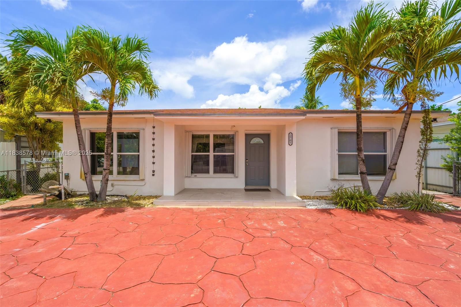 2761 Southwest 33rd Court Miami, FL 33133 - Photo 2 of 46 a front view of a house with a porch