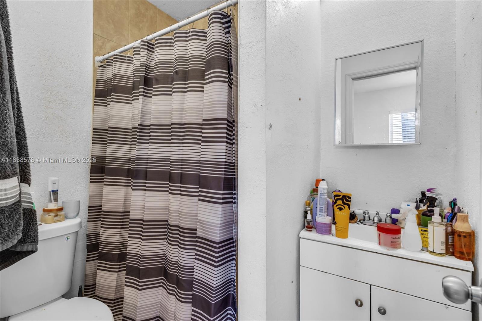 2761 Southwest 33rd Court Miami, FL 33133 - Photo 22 of 46 a bathroom with a sink toilet and shower