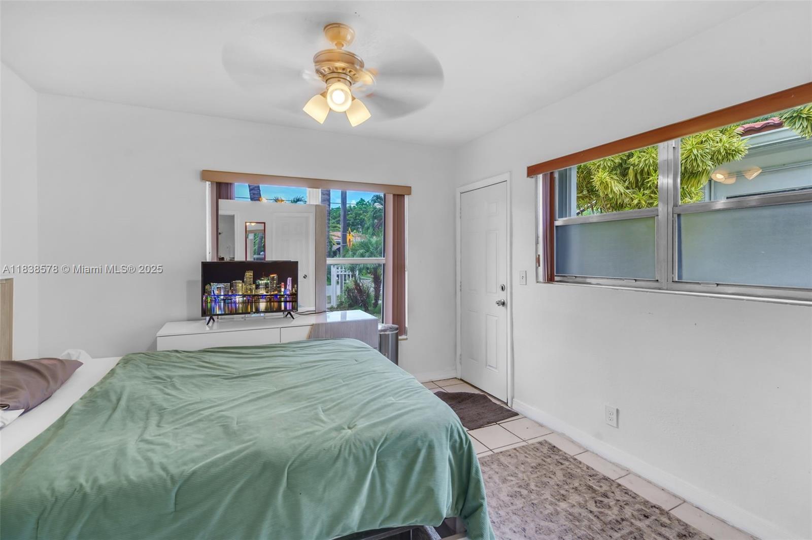 2761 Southwest 33rd Court Miami, FL 33133 - Photo 24 of 46 a bedroom with a bed and a window