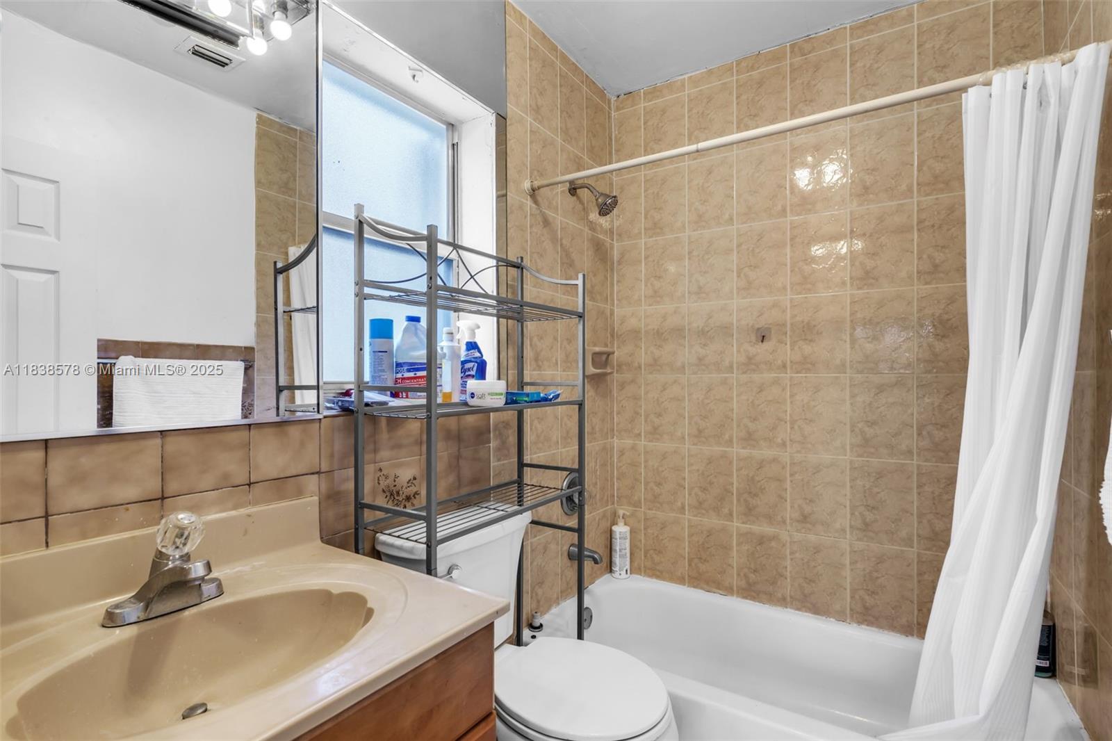 2761 Southwest 33rd Court Miami, FL 33133 - Photo 25 of 46 a bathroom with a sink toilet and shower