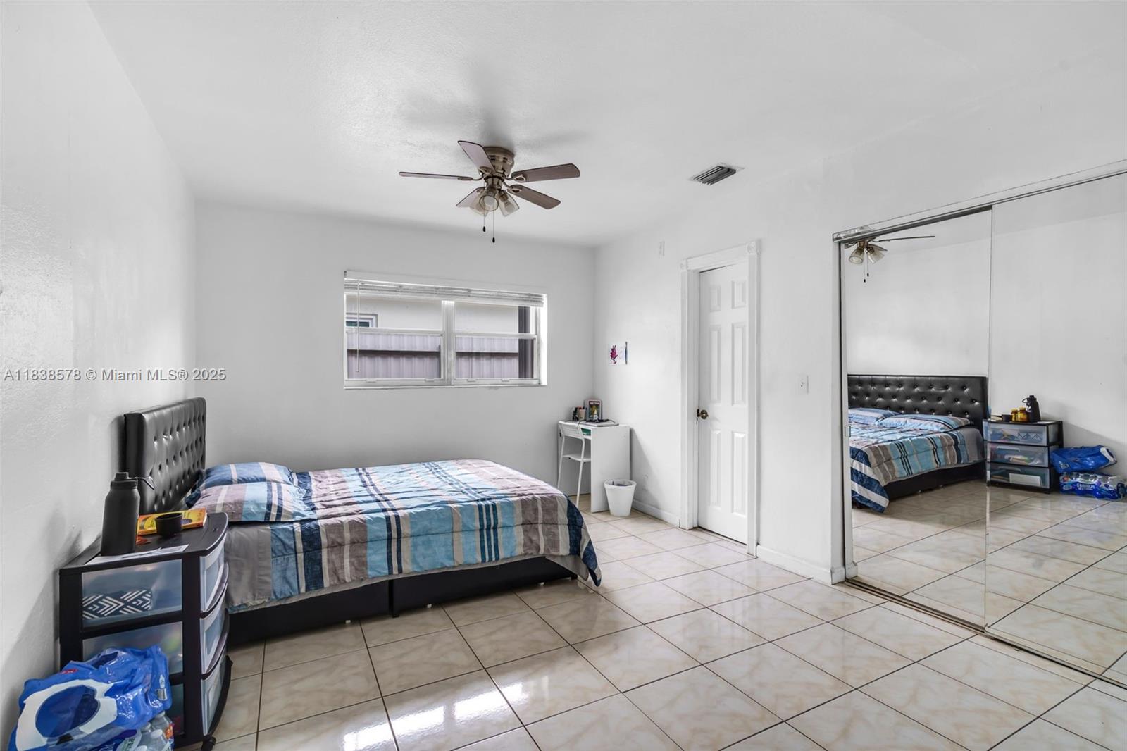 2761 Southwest 33rd Court Miami, FL 33133 - Photo 26 of 46 a bedroom with a bed and a cabinets