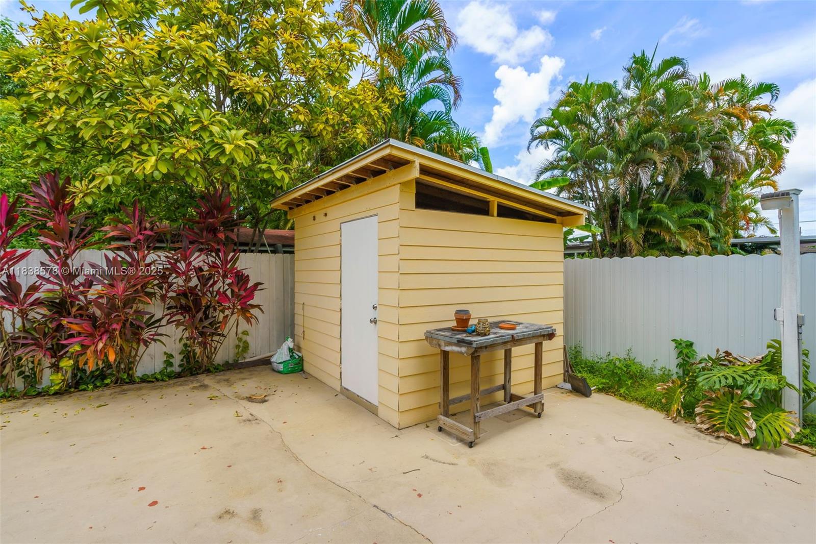 2761 Southwest 33rd Court Miami, FL 33133 - Photo 33 of 46 a view of a house with a yard and potted plants