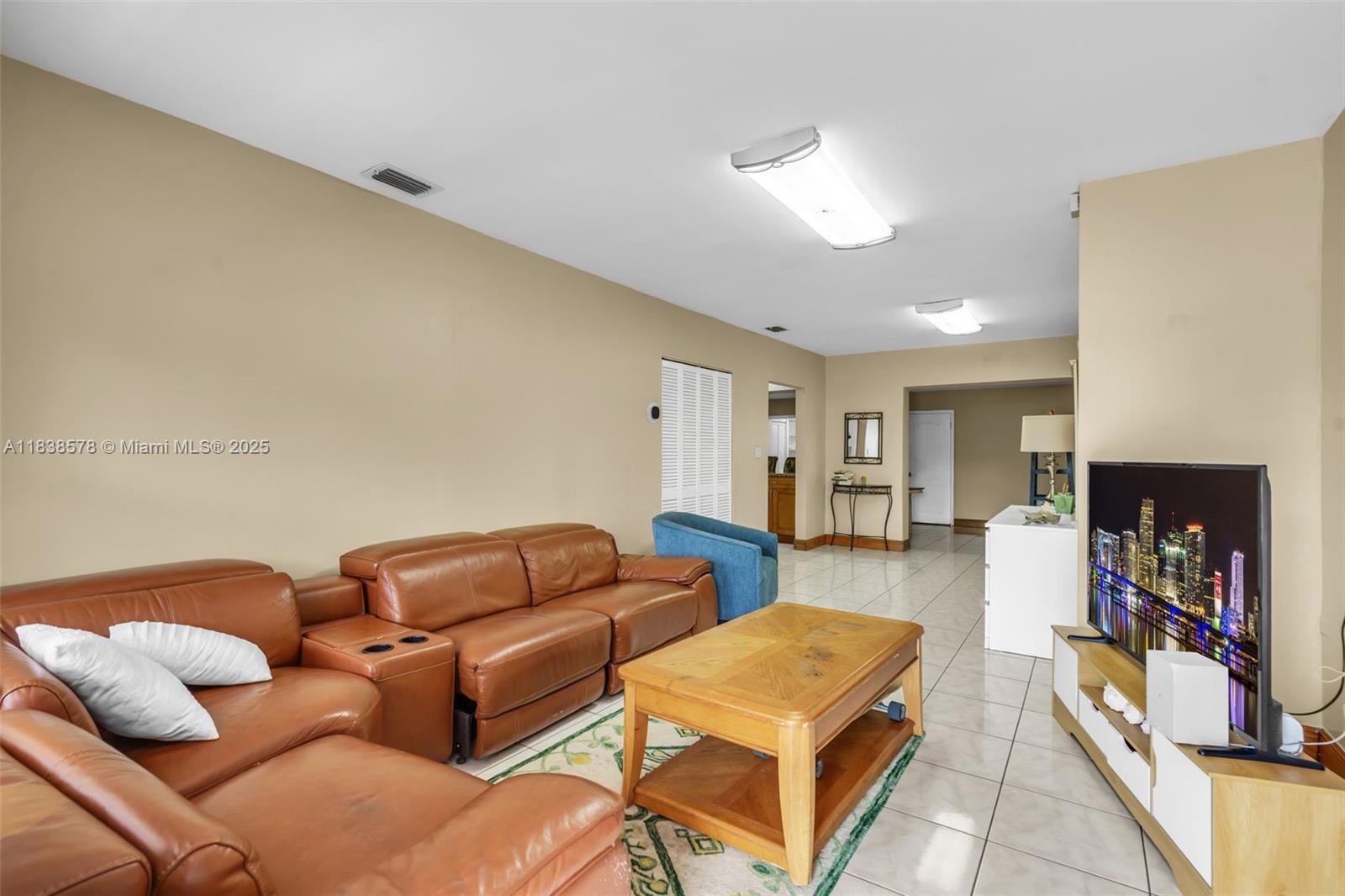 2761 Southwest 33rd Court Miami, FL 33133 - Photo 4 of 46 a living room with furniture and a fireplace