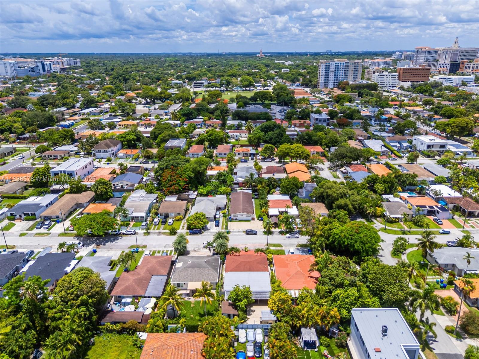 2761 Southwest 33rd Court Miami, FL 33133 - Photo 42 of 46 an aerial view of residential houses with outdoor space and trees