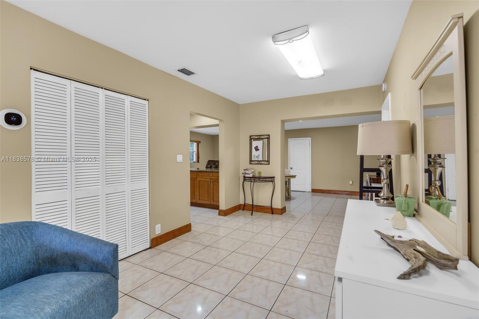 2761 Southwest 33rd Court Miami, FL 33133 - Photo 6 of 46 a living room with furniture and a flat screen tv