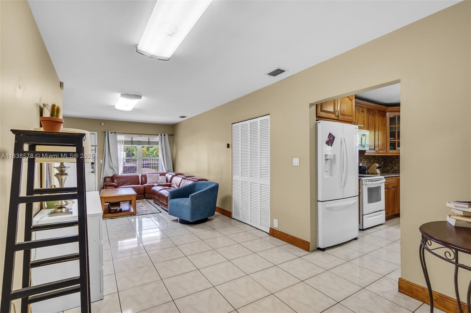 2761 Southwest 33rd Court Miami, FL 33133 - Photo 7 of 46 a living room with furniture and a window