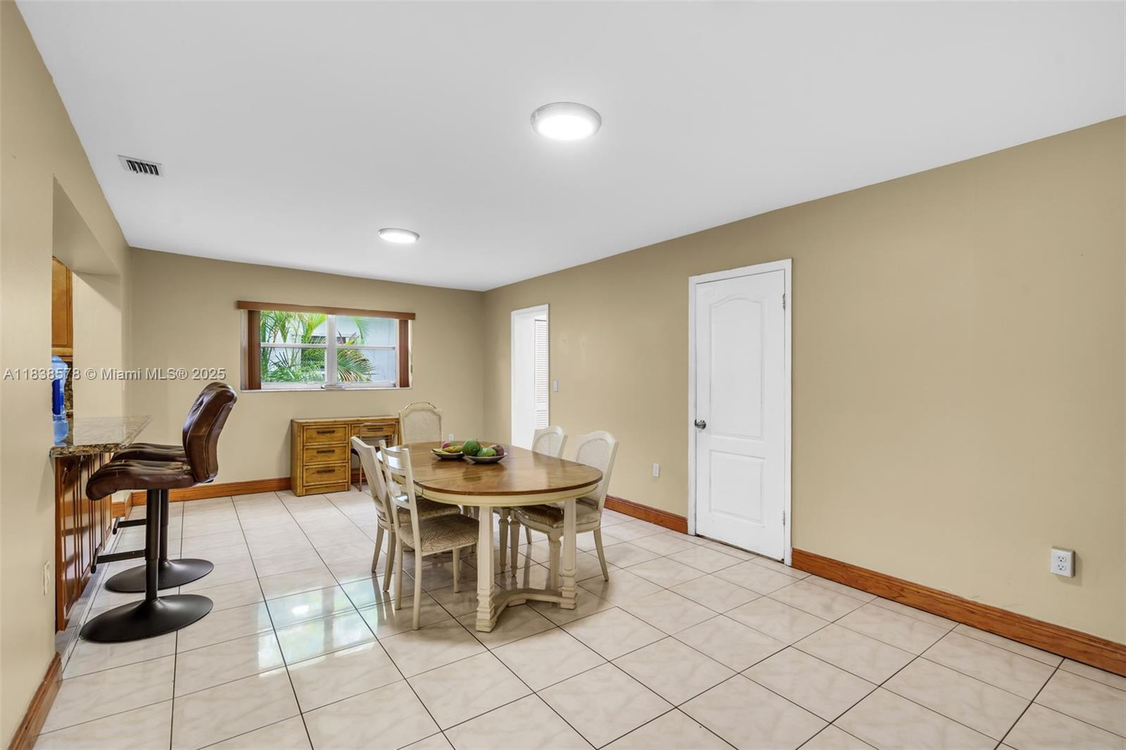 2761 Southwest 33rd Court Miami, FL 33133 - Photo 8 of 46 a living room with chairs and a window