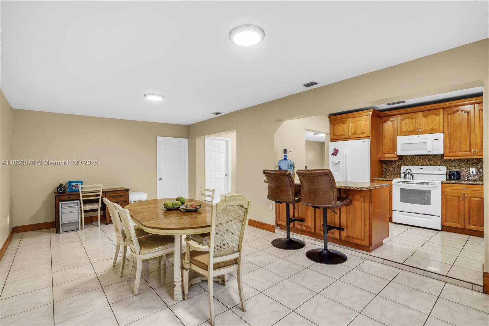 2761 Southwest 33rd Court Miami, FL 33133 - Photo 9 of 46 a view of a dining room with furniture and chandelier