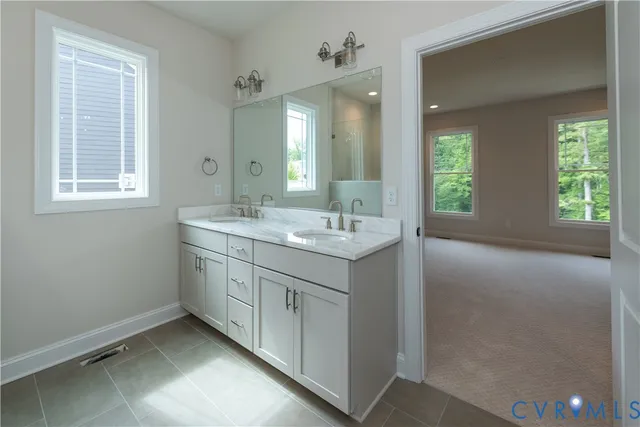 a view of kitchen with kitchen island wooden floor center island and stainless steel appliances