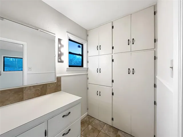 a view of cabinets with wooden floor