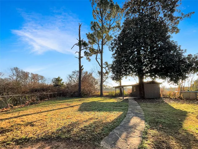 a view of a yard with an outdoor space
