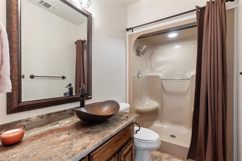 609 Seville Road Denton, TX 76205 - Photo 17 of 40 First floor full bath near garage entry. Convenient for pool guests.