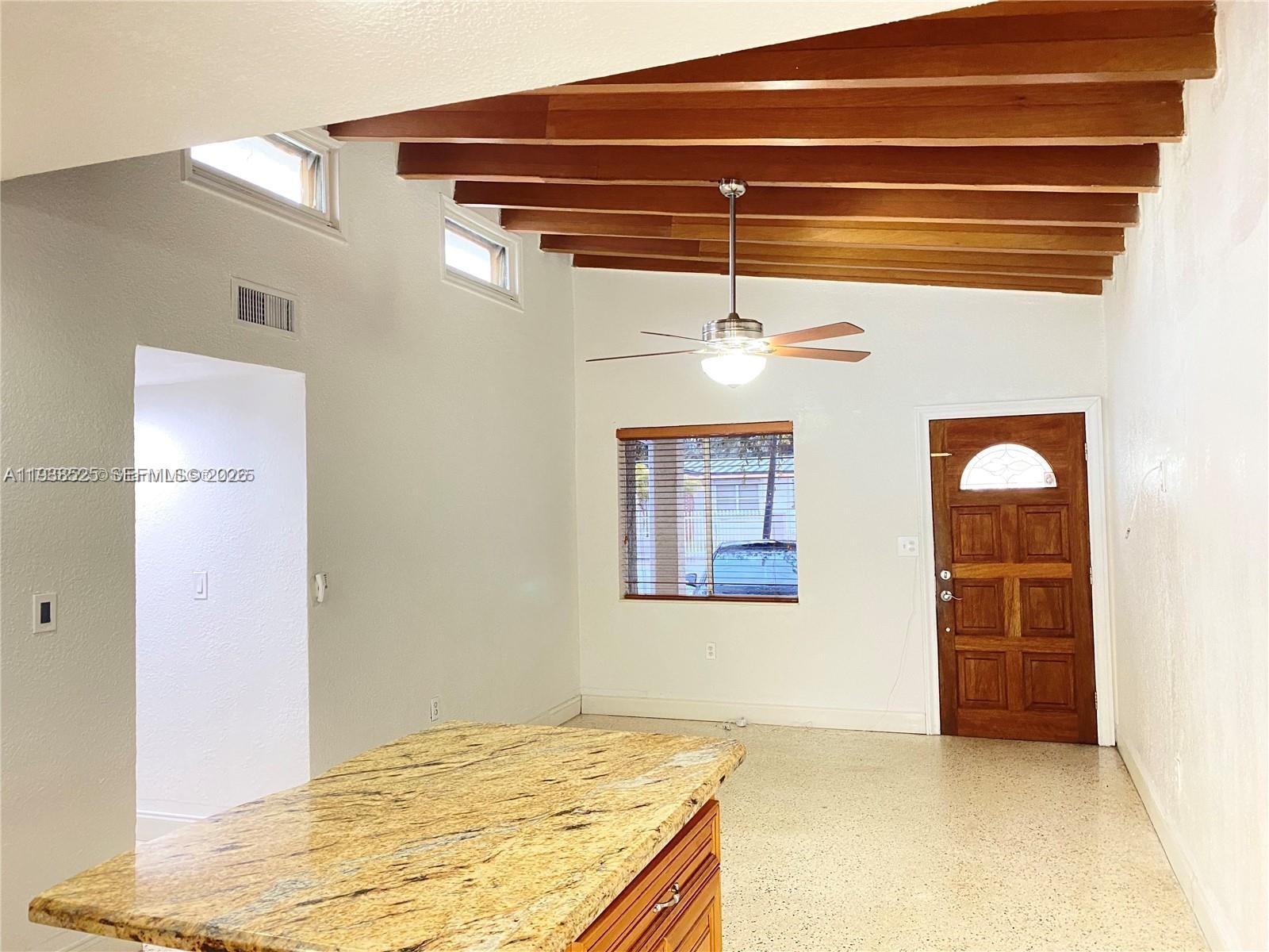 6181 Southwest 20th Street West Miami, FL 33155 - Photo 2 of 10 a view of a livingroom with a dishwasher and a refrigerator