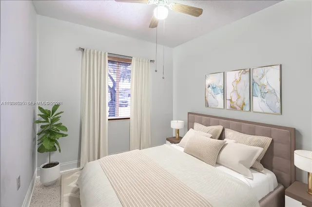 a bedroom with a bed and a window