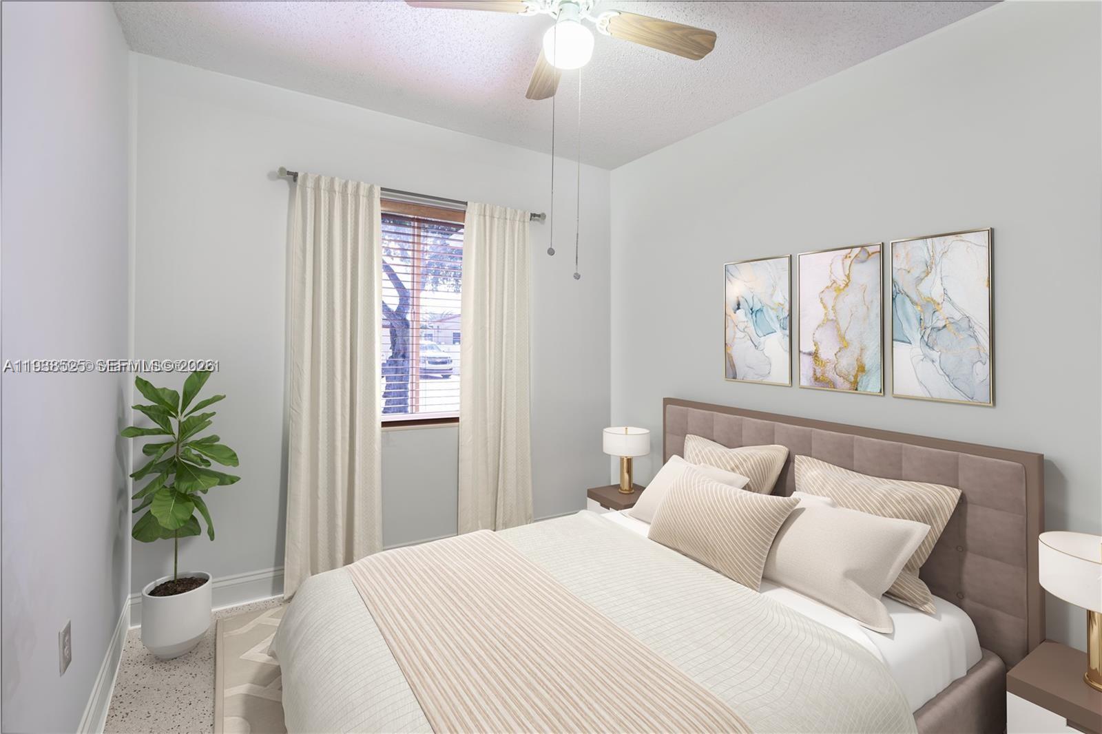 6181 Southwest 20th Street West Miami, FL 33155 - Photo 3 of 10 a bedroom with a bed and a window