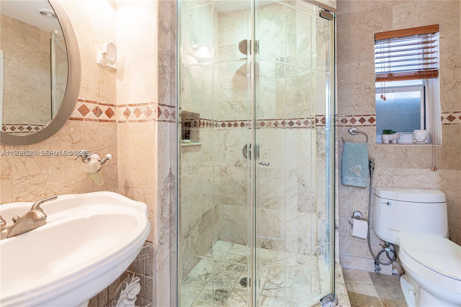 6181 Southwest 20th Street West Miami, FL 33155 - Photo 6 of 10 a bathroom with a sink toilet and shower