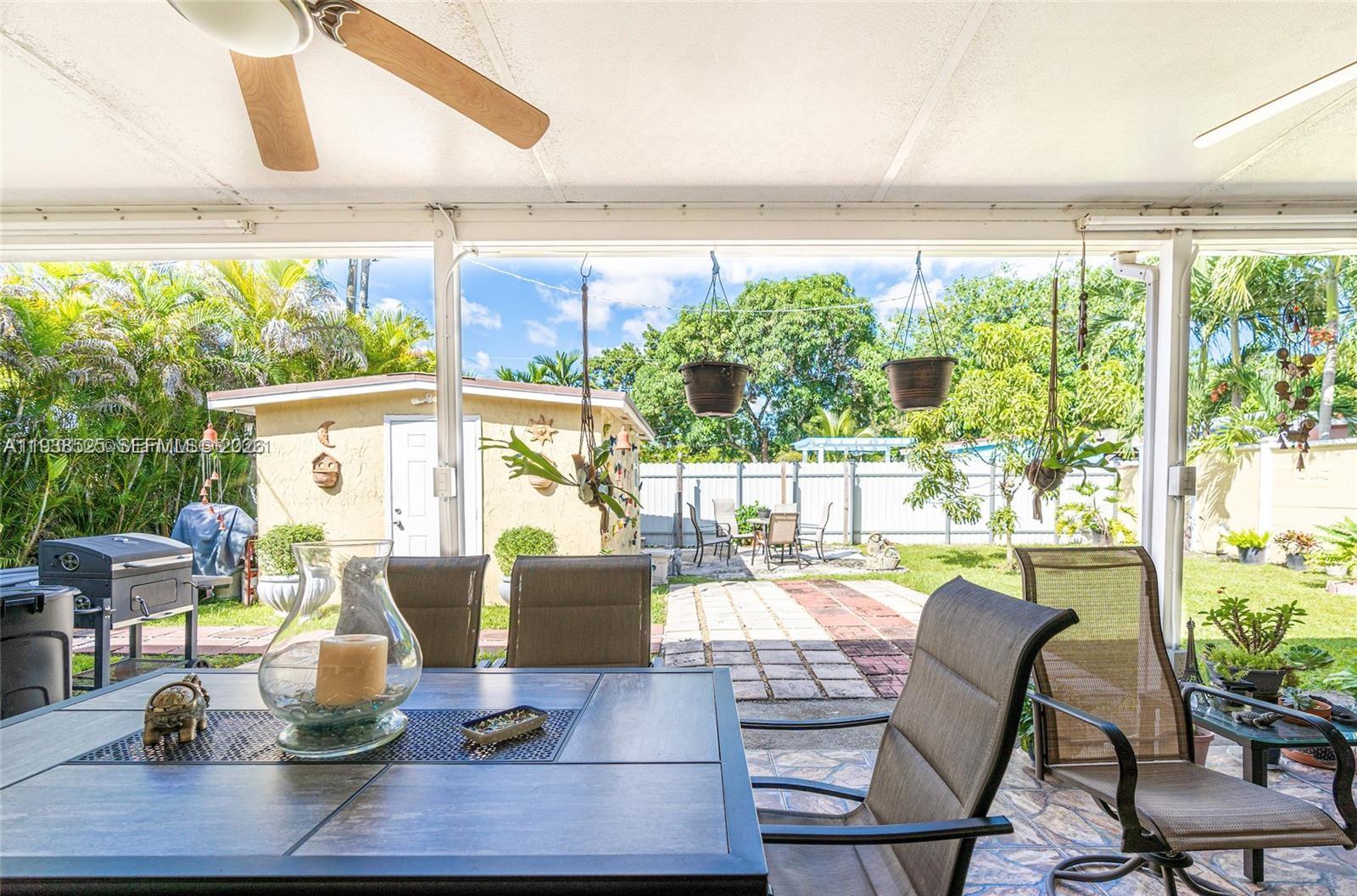 6181 Southwest 20th Street West Miami, FL 33155 - Photo 9 of 10 a view of a dining room with furniture window and outside view