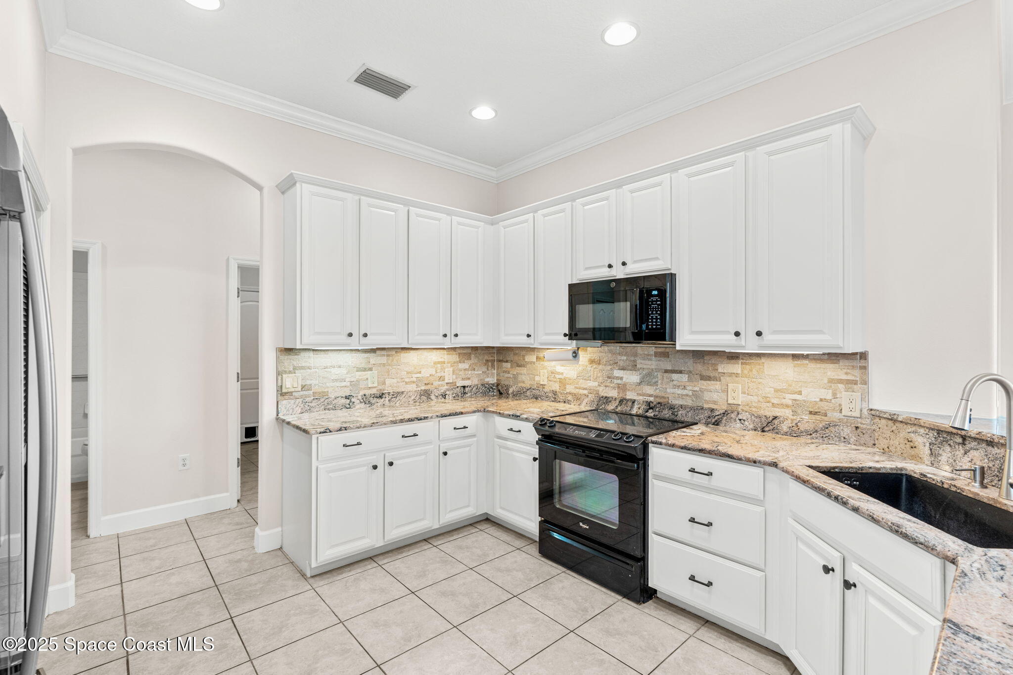 3121 Camberly Circle Melbourne, FL 32940 - Photo 16 of 52 a kitchen with a sink and cabinets