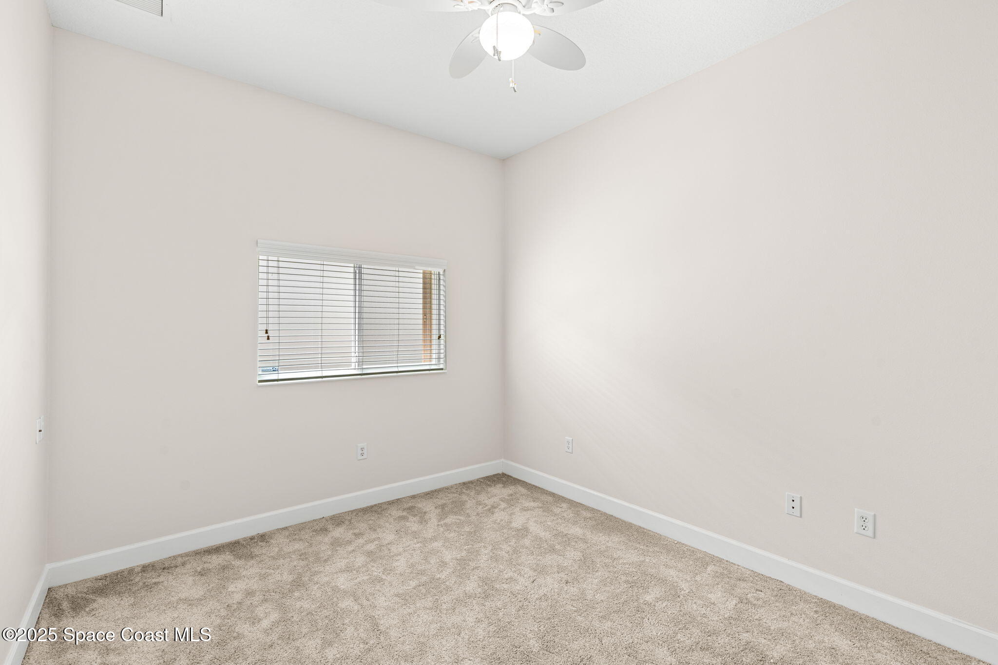 3121 Camberly Circle Melbourne, FL 32940 - Photo 24 of 52 an empty room with a window