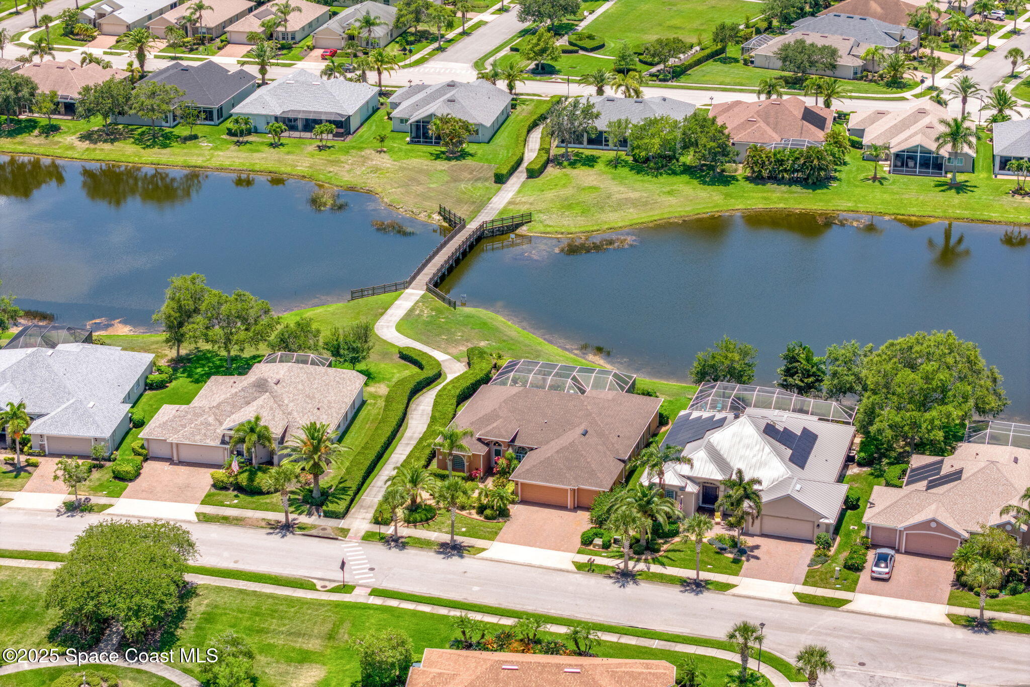 3121 Camberly Circle Melbourne, FL 32940 - Photo 42 of 52 an aerial view of residential houses with outdoor space and lake view