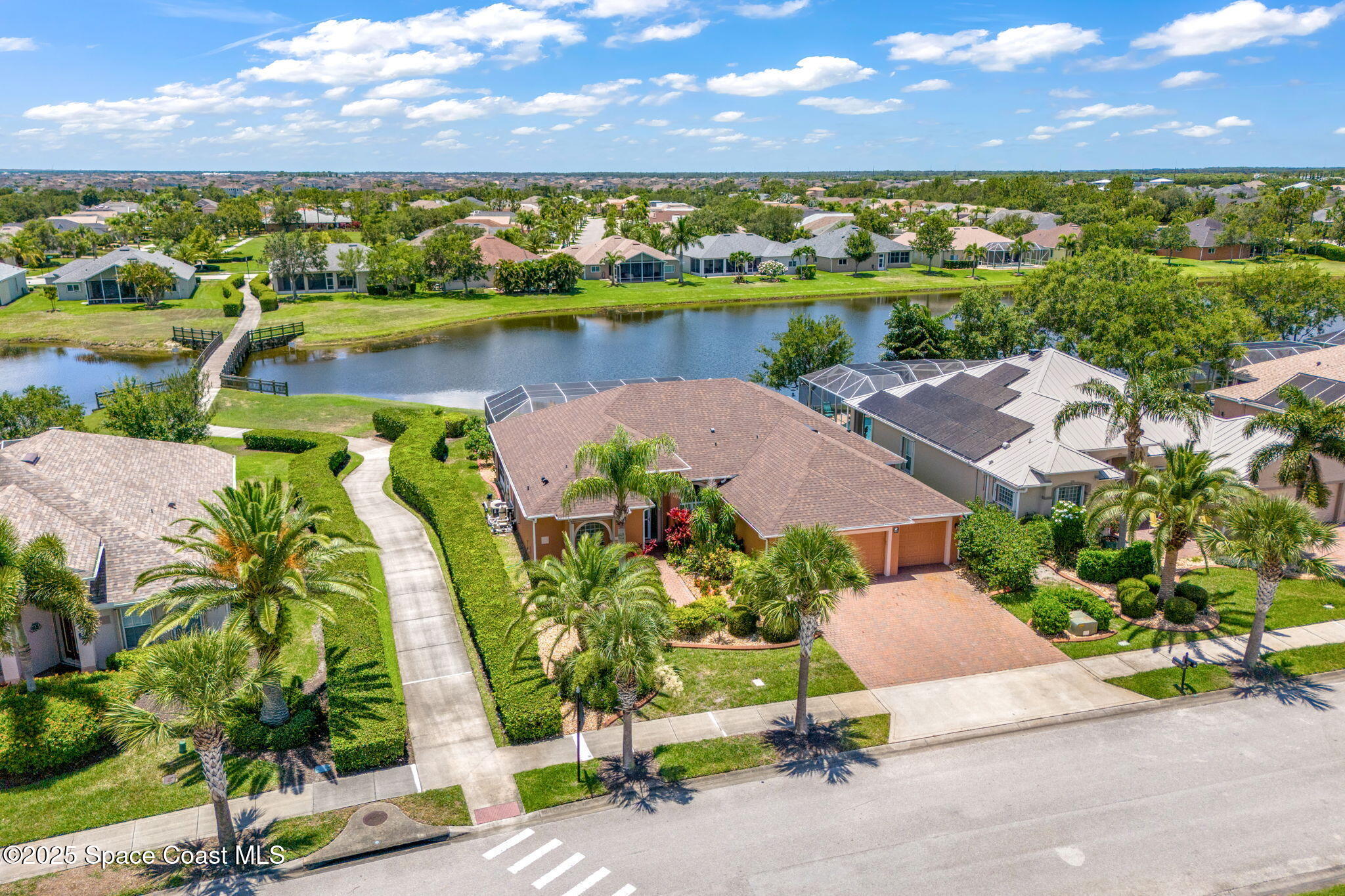 3121 Camberly Circle Melbourne, FL 32940 - Photo 6 of 52 an aerial view of a houses with a lake view