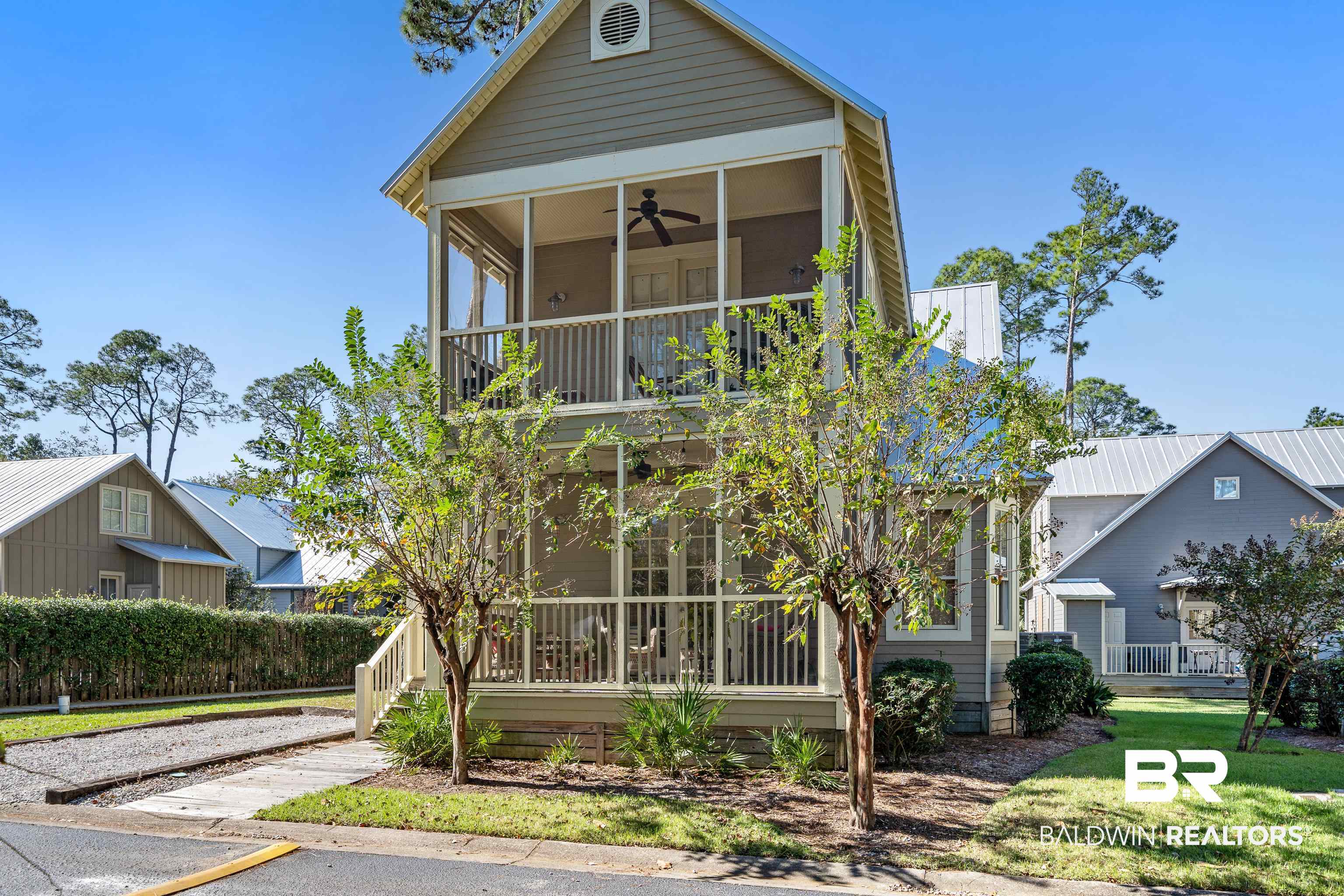 25773 Canal Road, Unit 10 Orange Beach, AL 36561 - Photo 2 of 40 View of front of property featuring screened porches