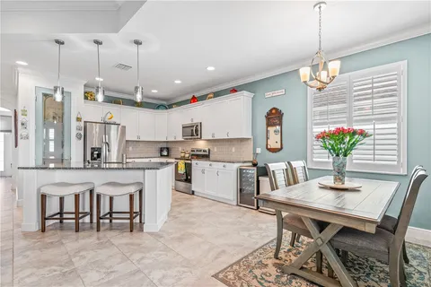 a view of a dining room with furniture window and outside view