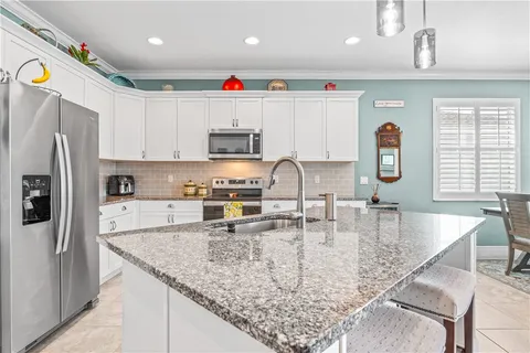 a bedroom with a bed and cupboard