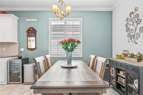 a spacious bathroom with a tub sink and mirror
