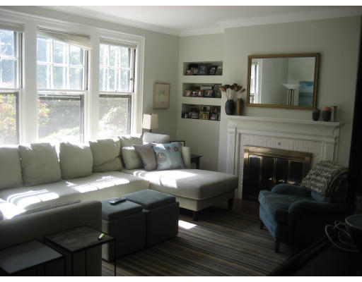 131 Gardner Road, Unit 1 Brookline, MA 02445 - Photo 6 of 10 a living room with furniture and a fireplace
