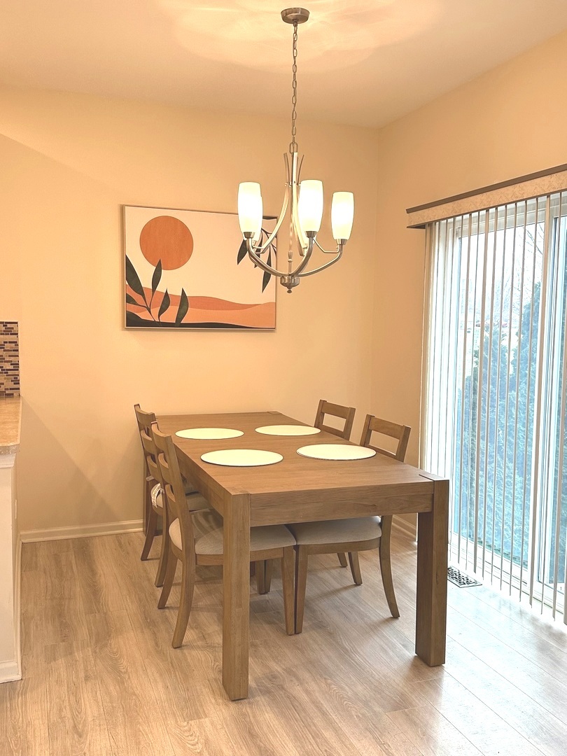 5102 Monroe Street Matteson, IL 60443 - Photo 15 of 54 a view of a dining room with a table and chairs